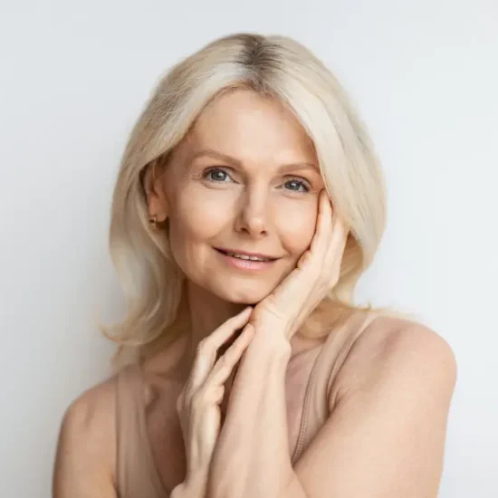 aged-beauty-concept-portrait-beautiful-senior-woman-touching-silky-skin-her-face-posing